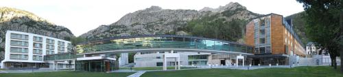 a view of a building with a mountain in the background at Hotel Continental Balneario de Panticosa in Panticosa