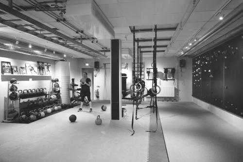 a room with a woman in a gym with balls at Second Home Apartments Asplund in Solna