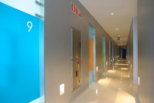 a hallway of a hospital with a sign on the wall at Hotel Continental Balneario de Panticosa in Panticosa