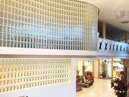 a building with a wall of glass bottles at Hotel Nueva Plaza in Maliaño