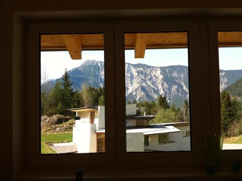 a view of mountains from a window at Villa 22 in Oetz