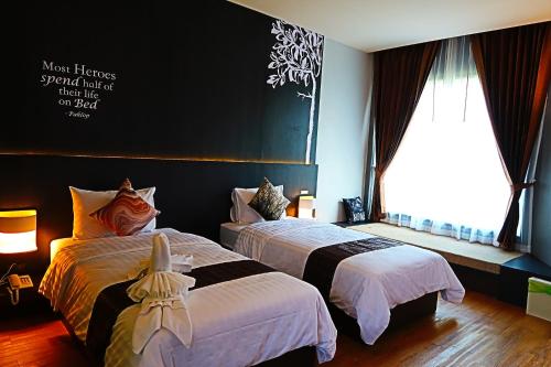 Tempat tidur dalam kamar di Paklop Resort