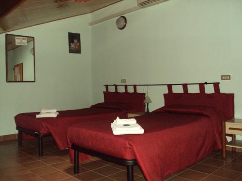 Postel nebo postele na pokoji v ubytování Albergo Airone