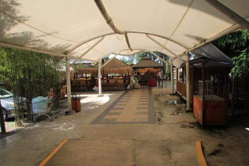 a covered walkway in a building with a tent at Marose Gold Coast Morib in Morib