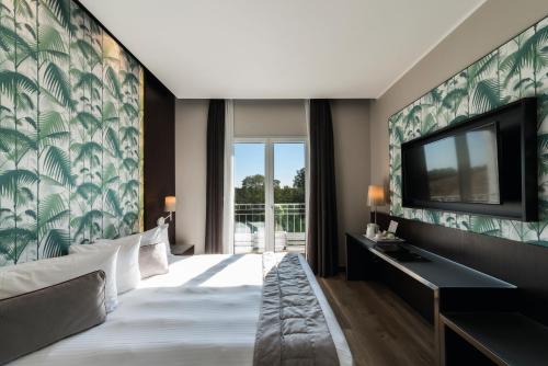 Ліжко або ліжка в номері Hotel Manin