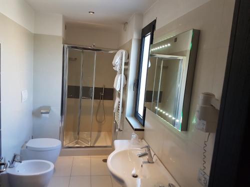 a bathroom with a shower and a sink and a toilet at Hotel Ristorante La Campagnola in Cassino