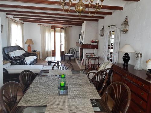 a living room with a dining table and chairs at Moraira Amazing Rustic Village in Moraira