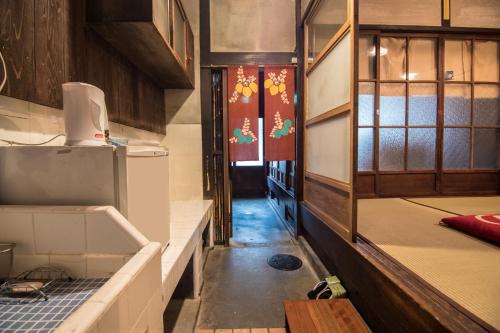 a small room with a kitchen and a hallway at YUMEJI Vintage Villa in Kyoto