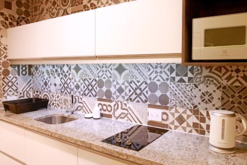 Kuchyň nebo kuchyňský kout v ubytování Urban Suites Apart Hotel