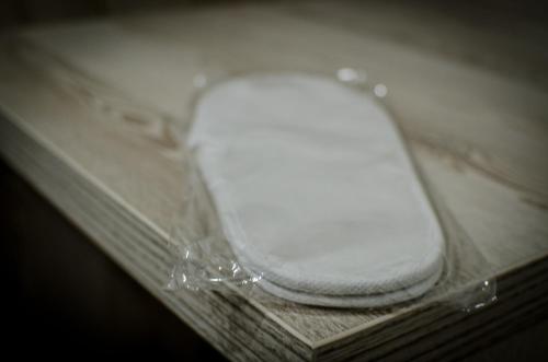 a white computer mouse in a plastic case at Hotel Metohija in Gacko