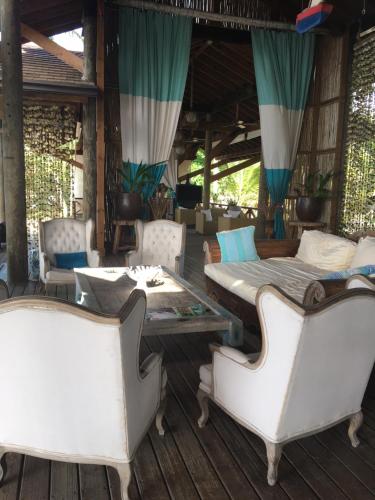 a room with two beds and a table and chairs at Apartment Balcones Del Atlantico in Las Terrenas