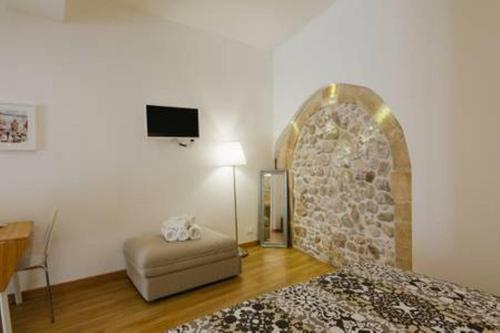 Ένα ή περισσότερα κρεβάτια σε δωμάτιο στο Giudecca Apartments