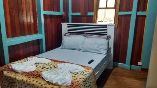 Ένα ή περισσότερα κρεβάτια σε δωμάτιο στο pousada ferreira's