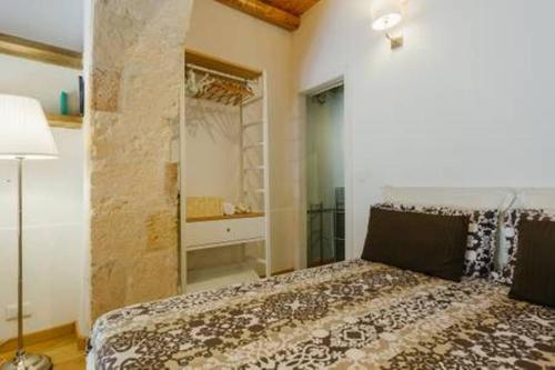 Ένα ή περισσότερα κρεβάτια σε δωμάτιο στο Giudecca Apartments