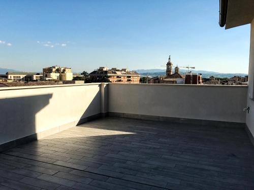 a balcony with a view of a city at Il Nido - Miniattico panoramico by AppartamentiPetrucci in Foligno
