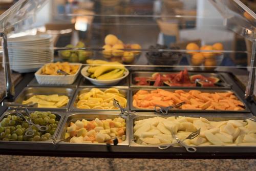 a tray of different types of fruits and vegetables at Hotel Weber Ambassador in Capri