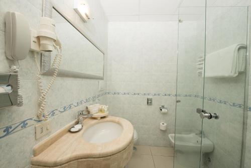 a bathroom with a sink and a toilet at Hotel Weber Ambassador in Capri