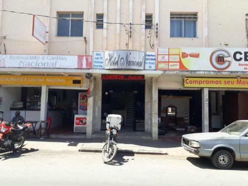 a bike parked on a street in front of a building at Hotel Nacional Montes Claros in Montes Claros