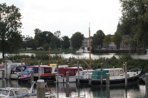 a group of boats docked at a marina at Hotel van Dijk in Kampen