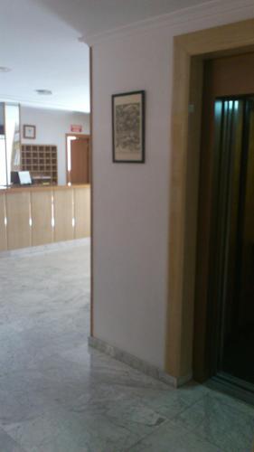 a wall with a picture on the side of a building at Hostal Juanito in Móstoles