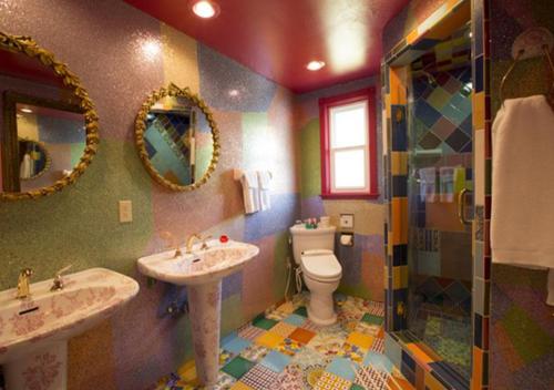 a bathroom with two sinks and a toilet at Madonna Inn in San Luis Obispo