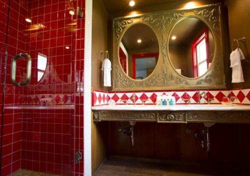 a bathroom with a sink and a mirror at Madonna Inn in San Luis Obispo
