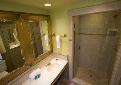 a bathroom with a sink and a shower at Madonna Inn in San Luis Obispo