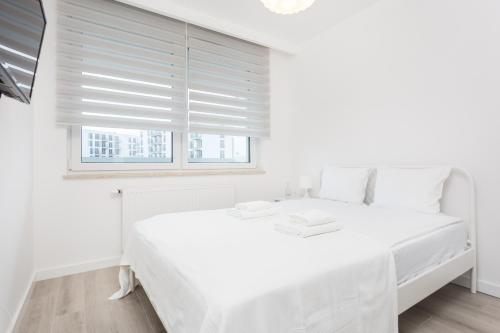 Posteľ alebo postele v izbe v ubytovaní Self Check - in 24h near Tauron Arena Apartments by InPoint