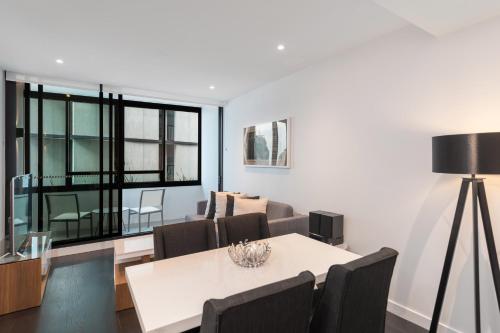 a living room with a white table and chairs at FV by Peppers in Brisbane