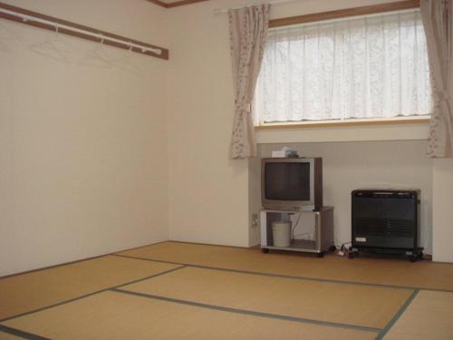 ペンションラパンにあるテレビまたはエンターテインメントセンター