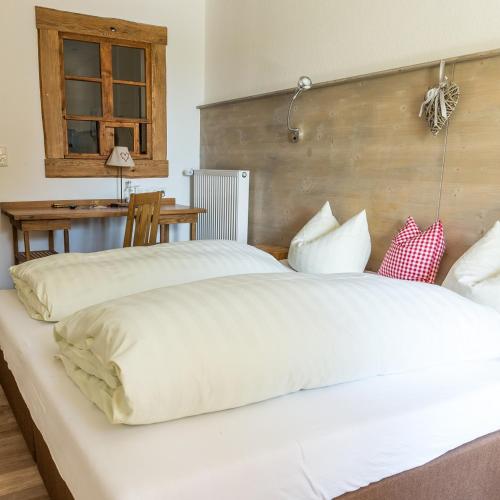 Ein Bett oder Betten in einem Zimmer der Unterkunft Brauerei-Gasthof Eck