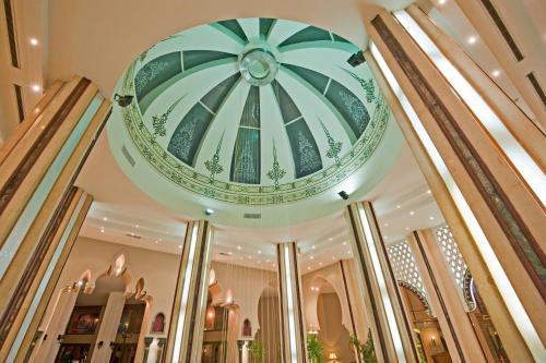 a large building with a large mirror in the middle of it at Sunny Days Palma De Mirette Resort & Spa - Families and couples only in Hurghada