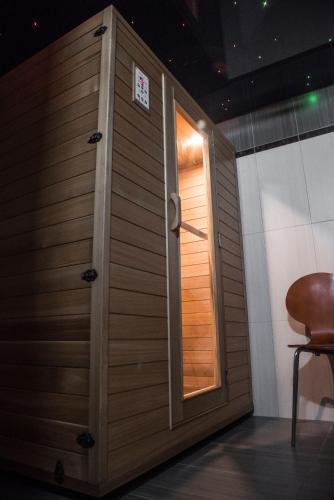 a wooden door with a window in a room at Theofilos Paradise Boutique Hotel in Mytilini