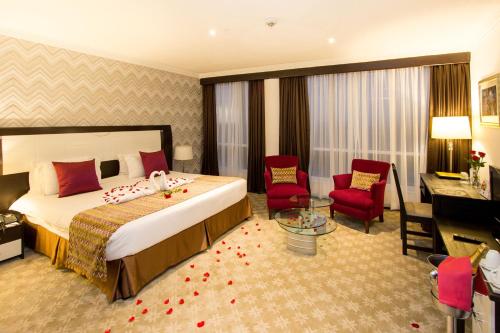 Tempat tidur dalam kamar di The Panari Hotel - Near Jomo Kenyatta International Airport