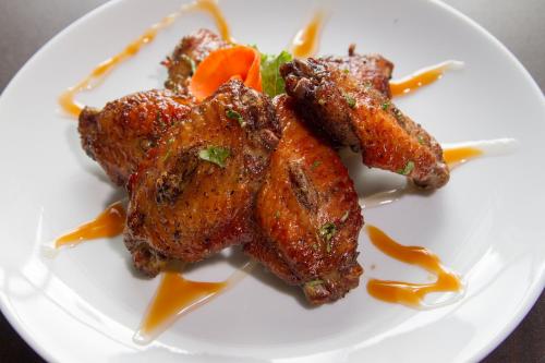 a plate of food with chicken and vegetables on it at New York Hotel in Phnom Penh