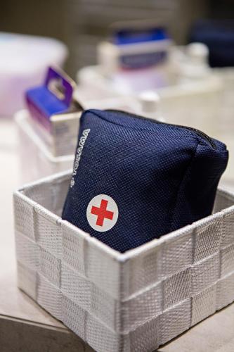 a plastic container with a red cross on it at City Center Apartment Sarajevo Accross BBI Shopping Mall in Sarajevo