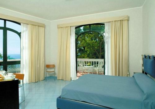 Katil atau katil-katil dalam bilik di Grand Hotel San Michele