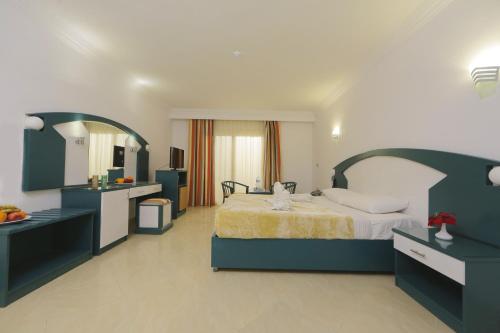 a large bedroom with a bed and a sink at Golden Beach 1 Ras Sedr in Ras Sedr