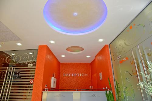 a ceiling with a sign that reads reception at Dream Hotel in Sliven