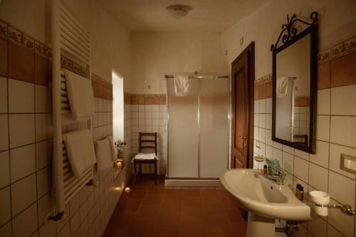 a bathroom with a sink and a toilet and a mirror at Monastero Di Sant'Erasmo in Veroli