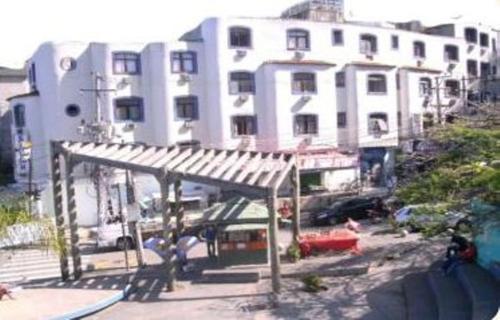 a large white building with a pavilion in front of it at Estalagem Motel (Adult Only) in Rio de Janeiro