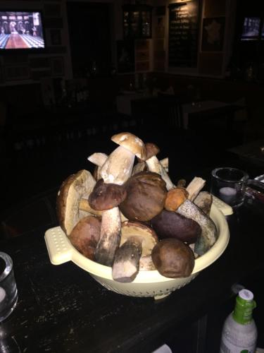 a bowl of mushrooms sitting on a table at Villa Rozmaryn & Gourmet in Mariánské Lázně