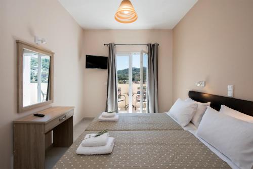 Postelja oz. postelje v sobi nastanitve Artheo Hotel