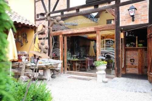 a store front with a table in front of it at Hotel Piccolo in Schleiz