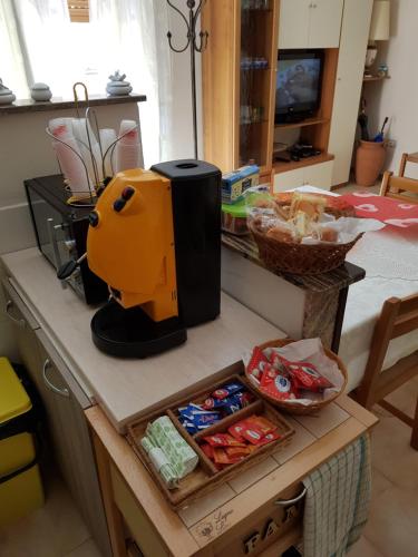 a kitchen counter with a blender on top of it at B&B Via Roma in Viggianello