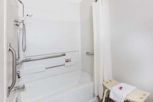 a bathroom with a shower and a toilet at Super 8 by Wyndham Aberdeen MD in Aberdeen