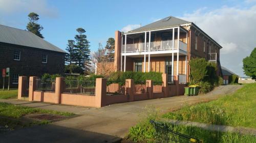 a house with a fence in front of it at Province in Portland