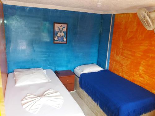 Tempat tidur dalam kamar di Hotel posada la casona