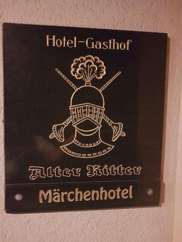 a sign on a wall with ahaarhaarhaarhaarhaarhaarhaarhaarhaar at Hotel-Gasthof "Alter Ritter" in Rothenburg ob der Tauber