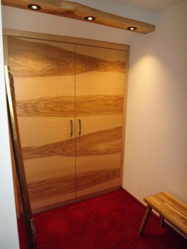 a large glass door in a room with a red carpet at Hotel Piccolo in Schleiz
